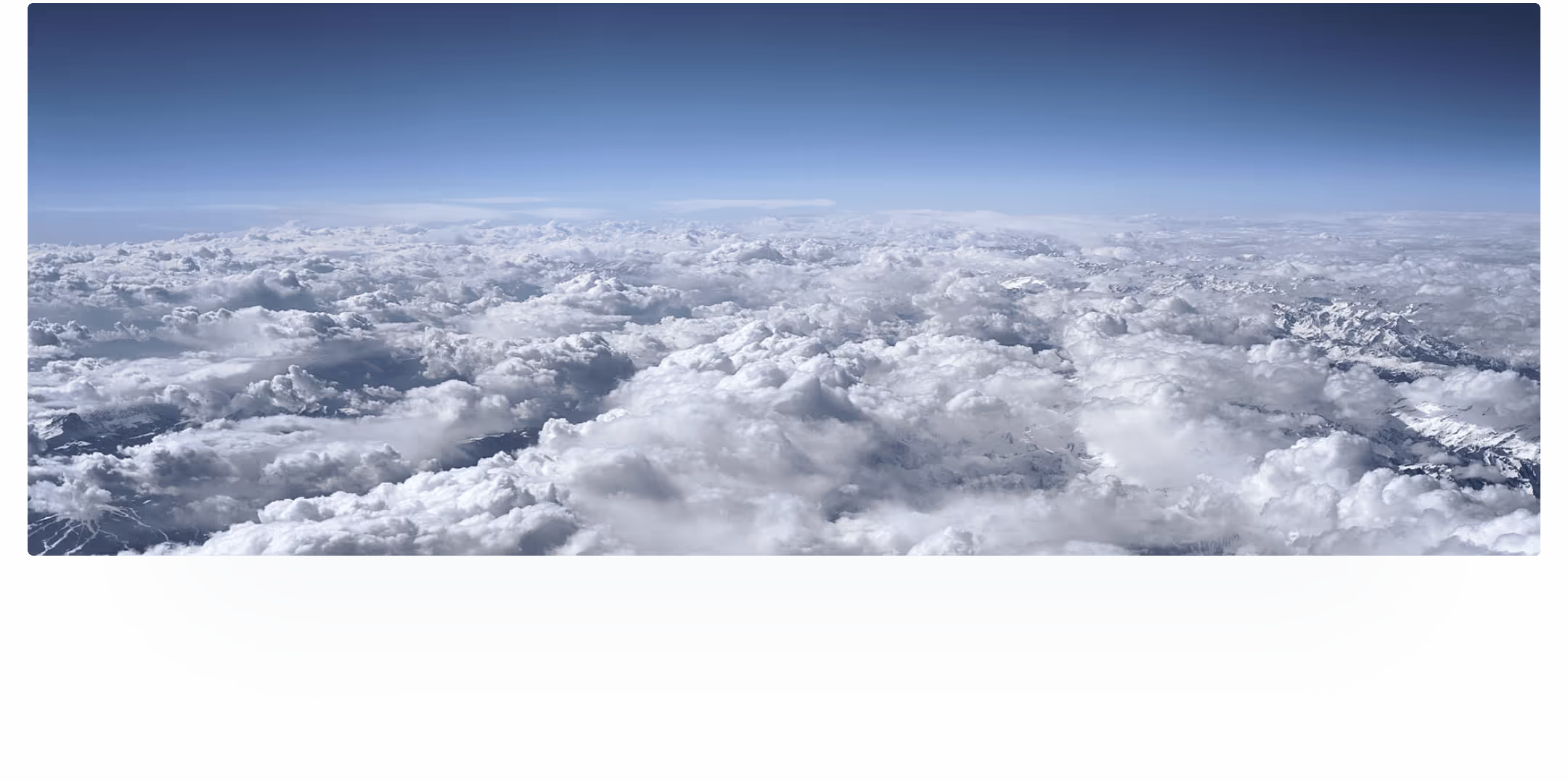 The mountains pierce the clouds